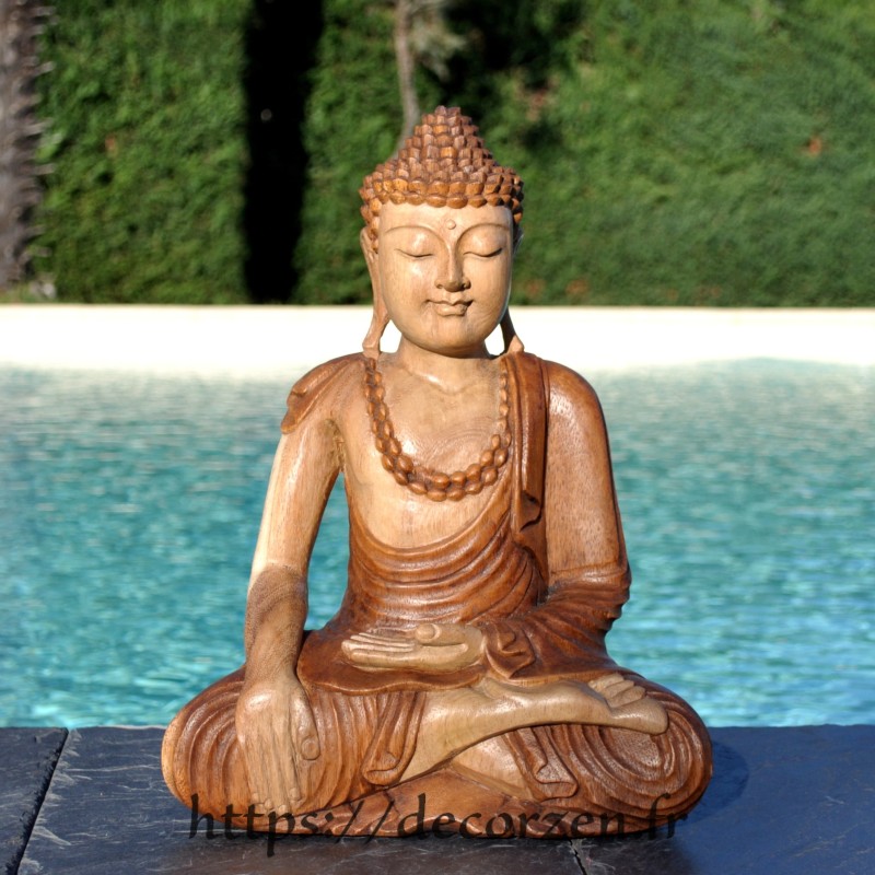 Magnifique Buddha en teck massif sculpté artisanalement.