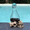 Verre recyclé soufflé et moulé sur du bois flotté