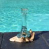 Un soliflore en verre recyclé fondu puis soufflé en fusion sur du bois flotté et le verre se sort pour le lavage