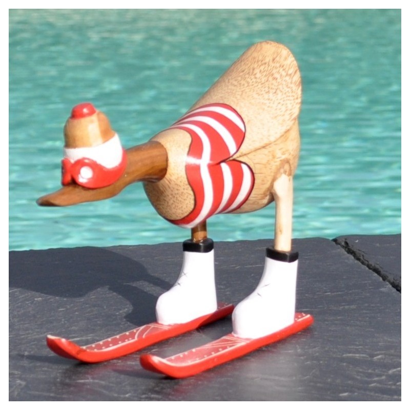 Un canard en bois de teck et racine de bambou en trazin de faire du schuss en ski