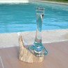 Un soliflore en verre recyclé soufflé en fusion sur du bois flotté dont le verre se sort pour le lavage au lave-vaisselle