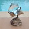 Aquarium en verre recyclé soufflé sur du bois flotté.